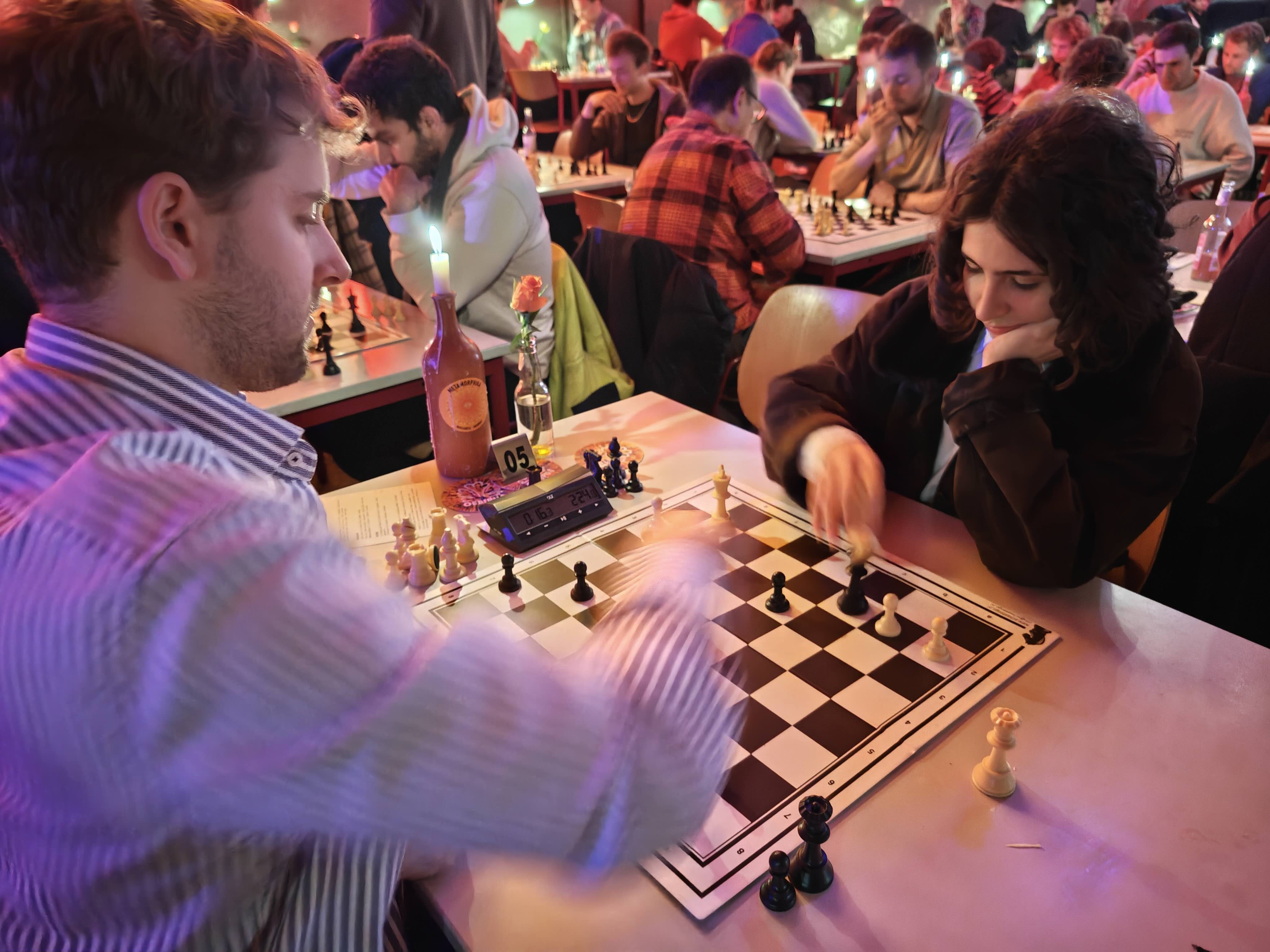 Players enjoying a blitz chess tournament at Bar Blitz